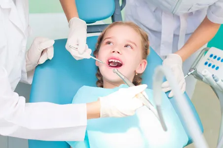 Happy child having dental work done